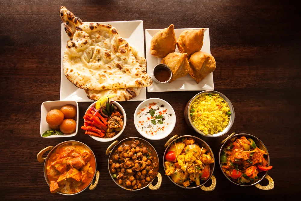 Contact Clay Oven Winnipeg — Authentic East Indian Restaurant at Kenaston Winnipeg and Downtown Blue Cross Park